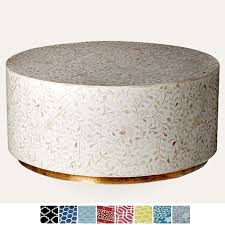 The bone coffee table with pedestal base $6,200. Maaya Brass Bone Inlay Round Drum Coffee Table White Floral