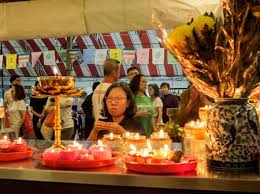 Vesak day is a holy day celebrated by buddhists. Singapore 18 May 2019 A Woman Kneels And Offers Incense To Stock Photo Picture And Royalty Free Image Image 136347910