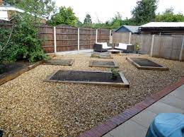 A gravel path bordered by a cobblestone curb is works well with many garden styles and is relatively easy to build and maintain. New Oak Railway Sleepers Raised Bed Gravel Garden