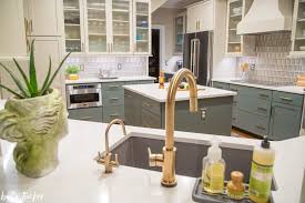 Paint the wall with the light hue. Cabinet Refinishing A Tuscan Modern Kitchen Update Bella Tucker