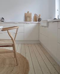 Simple white cabinets up top, oak stools, and white picket style backsplash tiles. Kitchen Scandinavian Interior Scandinavian Interior Design Minimalist Kitchen