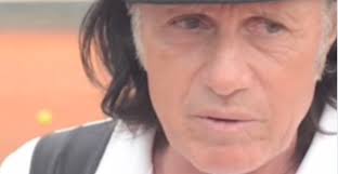 Guillermo Vilas receives an award from King Carl Gustaf