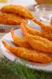 Breaded Shrimp Golden Fried To Perfection Served On A Stack Of French Fries Wi Ad Fried Perfection Serve Fried Shrimp Recipes Breaded Shrimp Recipes