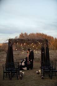 For many of these images, i could not find the original source. Black Wedding Altar With Rustic Branch Accents And Suspended Light Bulbs Featured On Trendy Bride Halloween Wedding Styled Wedding Shooting Dark Wedding