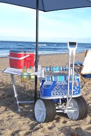 Beach Cart With Table That Stows Flat Against The Side With The Integrated Cup Holders And A Secure Spot For Your Umbr Beach Wagon Cart Beach Wagon Beach Cart