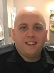 Officer John Flinn charged with hitting teen responded to a fight.