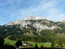 A bathroom with a shower and a hairdryer is standard in every apartment. Skifahren Nesselwangle 2021 Tirol