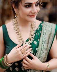 Beautiful Rimmy Tommy in a double border benarasi saree paired with a  monotone rawsilk blouse. .  #benarasi#celebstyle#greensaree#celebrity#instafashion#rimmytommy#saree#drape#sareestyle#bridesofinstagram#madhuramveppu#sareelook❤️