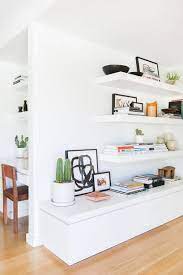 A living room with chic minimal approaches by the floor vases. Corner Pleasures Minimalist Living Room Decor House Interior Minimalist Living Room