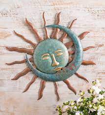 Symbols of sleep and sleepiness, they often adorn the walls of nurseries. Sun Kissing Moon Metal Wall Art Wind And Weather