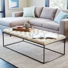 Tufted ottomans also serve as stunning coffee tables that are both aesthetic and versatile. Tufted Ivory Coffee Table