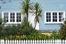 Check spelling or type a new query. Old Wooden House With Pale Blue Exterior Paint And Flower Garden Behind White Slate Fence Stock Photo Picture And Royalty Free Image Image 145668700