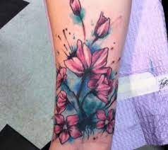 50 Gorgeous Small Wrist Tattoos To Always Flaunt Watercolor Wrist Tattoo Small Wrist Tattoos Wrist Tattoo Cover Up
