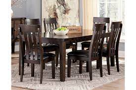 Johurst country height dining room set by ashley furniture industries inc. Haddigan Extendable Dining Table Ashley Furniture Homestore