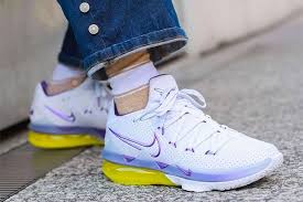 The pair sports a black knitposite upper with purple and yellow detailing wrapping the heel. Lebron James Sneaker Freaker