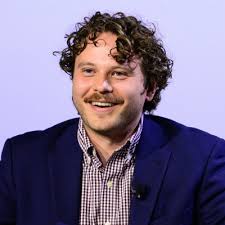 Velocity-field measurements in a GaN/AlN two-dimensional hole gas