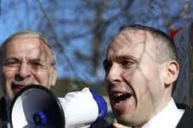 Area resident George Weill points out how difficult traveling through  Midwood will become if the NYSDOT changes come into play.