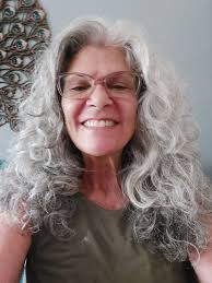 Curling hair with age, considering shorter styles