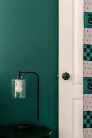 Create unique castle walls using flagstone patterned paper. Slytherin Inspired Bedroom A Beautiful Mess