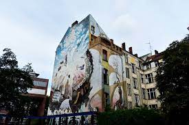 raffa trova my street art collection mural on tommy weisbecker haus in berlin by variou tanks that get around is an street art mural travel tank tops