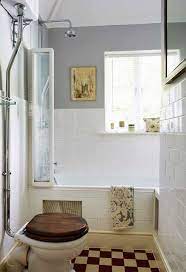 Stylish dark bathroom with floral wallpaper, green cabinets and modern bathtub. Pin By Rachel Bruhn On Projects Plans Victorian Style Bathroom Shabby Chic Bathroom Traditional Bathroom