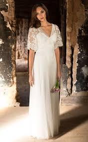 Wedding Dress Of Embroidered Tulle With Bell Sleeves And A V Neck Satin Button Back Cl Wedding Dresses Whimsical Fairy Wedding Dress Backyard Wedding Dresses