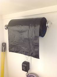 Paper Towel Holder For Trash Bags On A Roll In The Garage Organization Hacks Home Organization Storage And Organization