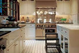 Stylish black and white kitchen with dark cabinets. Cream Cabinets Traditional Kitchen J Randall Powers