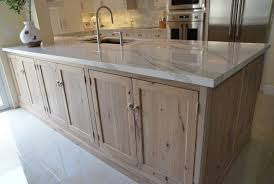 The window casing above the farmhouse sink is angled to allow for more light, while adding a nice. Driftwood Stained Kitchen Cabinets Kitchen Ideas Style