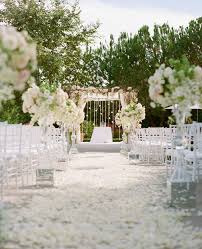 Outdoor wedding ceremony, chairs decorated with flowers and ribbons stand in rows on the grass. 40 Romantic Wedding Aisle Petals Decor Ideas Deer Pearl Flowers