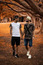 Gesture which signifies friendship when two guys hold hands. 320x568px Free Download Hd Wallpaper Two Men Holding Hands Love People Togetherness Trees Two People Wallpaper Flare