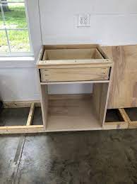 It gives the garage a modern look while keeping the area neat and tidy. My Dream Workshop Cabinets Sawdust 2 Stitches
