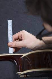 Generally, fender electric guitars with a 9.5 fingerboard radius come out of the factory with 4/64 between string and fingerboard. How To Set Up Your Electric Guitar Part 2 Setting Action Sweetwater