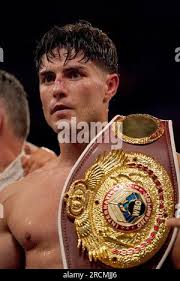 Josh Kelly poses with his title belt after being announced as winner by  unanimous decision after