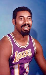 Philadelphia Warriors owner Eddie Gottlieb awaits the signature of Kansas  University Jayhawks center Wilt Chamberlain