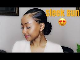 Form a deep side part and twist a section of hair across the hairline, securing it into a braid. How To Low Sleek Bun On Natural Hair Youtube