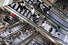An escalator is a moving staircase which carries people between floors of a building or structure. The Design History Of The Escalator By Design Abc Radio National Australian Broadcasting Corporation