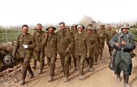 British prisoners, most of them wounded, being escorted by German guards to  a dressing station after the attack at the Oppy Wood, 1 May 1917. Private  T. Spencer is shown smoking a
