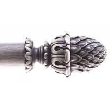 This silver curtain rod has a vintage feel thanks to its detailed finials. Alison Davies Antique Silver Curtain Pole Sherwood Finial