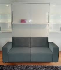 A murphy bed with a couch takes hidden furniture to a higher level. Murphysofa Wall Beds Fold Perfectly Over Sofas Desks Tables