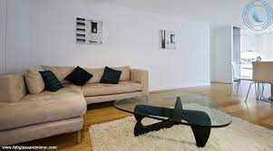 The design is both ethereal and practical: Noguchi Style Coffee Table Red Color With Black Glass Top