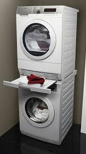 While many stackable washers and dryers promise quiet operation, this. Stacked Washer Dryer Laundry Room Storage Shelves Tiny House Laundry Laundry Room Closet