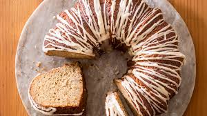 While the cakes bake, cook the remaining 1/2 cup of granulated sugar with the remaining 1/2 cup orange juice in a small saucepan over low heat until the sugar dissolves. Apple Bundt Cake