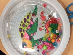 Ocean Drum Paper Plate Draw Or Glue Pictures Of Aquatic Animals Put In Colorful Beads Cover With Clear Plastic Plate Ta Music Crafts Ocean Drum Plate Drawing
