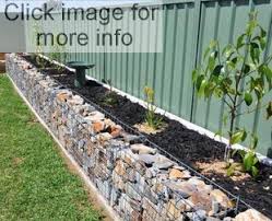 A collection of backyard retaining wall ideas and terraced gardens. Garden Retaining Walls Gabion1 Uk