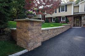 Cinder block masonry is easier than stone masonry but can still be hard work. Retaining Walls For Driveways And Parking Lots