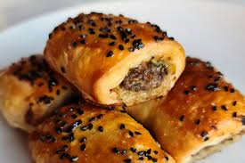 A buttery puff pastry baked to golden perfection gives a delightful flakiness and crisp texture to accompany the hearty meat filling made out of eggs, sausage, onions, and spices. Star Chef S Recipe For Lamb Sausage Rolls With Middle East Spices