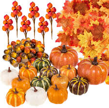 A gold and amber thanksgiving arrangement with lights, leaves, wheat and pumpkins is a beautiful decoration. Artificial Fruits Home Kitchen Halloween Artificial Pumpkin Flowers Bonsai Decoration Orange Fruit Ornament Table Centerpiece Props For Halloween Thanksgiving Autumn Fall Decoration
