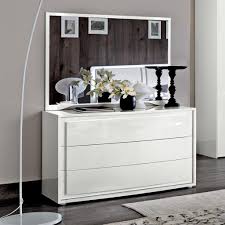 Minimalist white console table with high gloss finish. Dario White High Gloss 3 Drawer Chest Lycroft Interiors