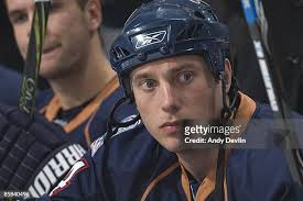 Erik Cole of the Edmonton Oilers stops with the puck against the... News  Photo